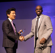Dr. W. P. Andrew Lee (left) presents a Rising Star Award to Dr. Dale Okorodudu.