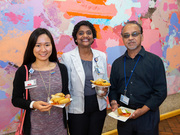 Employees gather after grabbing lunch at the reception.