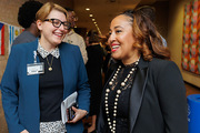 Courtney Rottman, Chief of Staff in the Office of the President, and Ms. Bell share laughs at the reception.