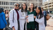 Sarah Greenfield (in green), celebrates her match with some medical school friends.