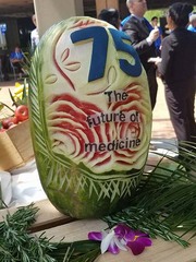 Attendees were greeted with tropical fruit stand that included a watermelon carved for the occasion.