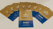 A spread of PACT Platinum and Gold pin celebration event programs.