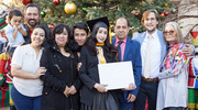 Master of Science in Health Informatics graduate Nelly Estefanie Garduno Rapp celebrates the festive occasion surrounded by her family.