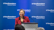 Helen Yin, Ph.D., Associate Dean of the Office of Women’s Careers and Professor of Physiology welcomes guests to the display unveiling. Dr. Yin and Dr. Mirpuri, both honorees, led the initiative to honor the trailblazing women of UT Southwestern.