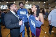 (Left to right) Ali Khurram, Trey Cinclair, and Maria Reynolds celebrate with blue shirts.