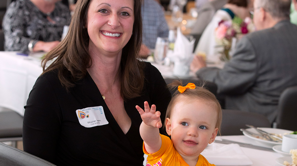 Meghan Irwin holding daughter