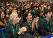 Dr. Alice Jean (center), winner of the latros Award and Minnie Lancaster, M.D., Scholarship Award in Family Medicine, applauds as she and classmate, Dr. Clara Telford (left) soak in the moment.