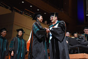 Dr. James Wagner congratulates a graduating medical student.