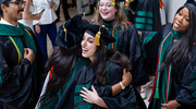 Joelle Abdallah, M.D. (center front), gave a big hug to a fellow classmate to celebrate graduating from UT Southwestern Medical School surrounded by (top, from left) graduates Jai Prasadh, M.D., Sarah Dolphin, M.D., and Nina Stephen, M.D. The May 16 commencement ceremony in the Morton H. Meyerson Symphony Center honored the years of hard work of 226 graduates, who shared emotional embraces, commemorating the journey they had undertaken to become physicians.