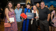 Martyna Kosno-Vega , Ph.D., and family pose for a photo at the reception following commencement.