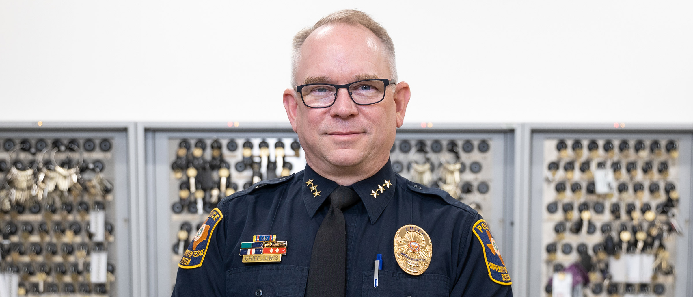 man in police uniform background of keys