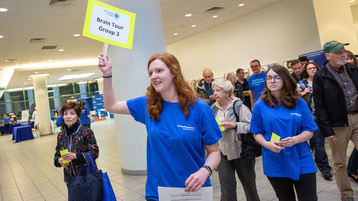 Volunteers lead visitors on a tour of neuroscience labs.