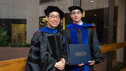 Junjie Ma (right) shows off his diploma with his mentor, Jae Mo Park, Ph.D., Assistant Professor of Radiology and the Advanced Imaging Research Center.