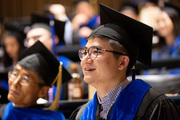 Dr. Zhongxu An listens to instructions before the ceremony.