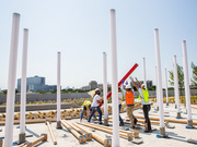 During the day, the brightly painted steel poles dominate the experience.