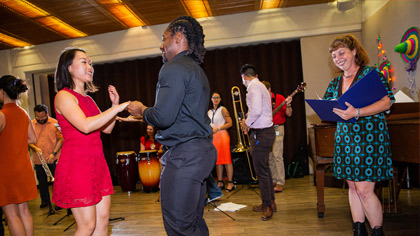 People dancing in front of a band