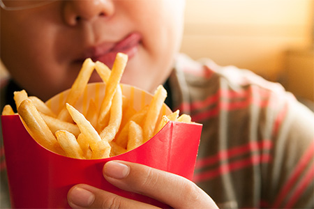 Decorative image of child and fast food