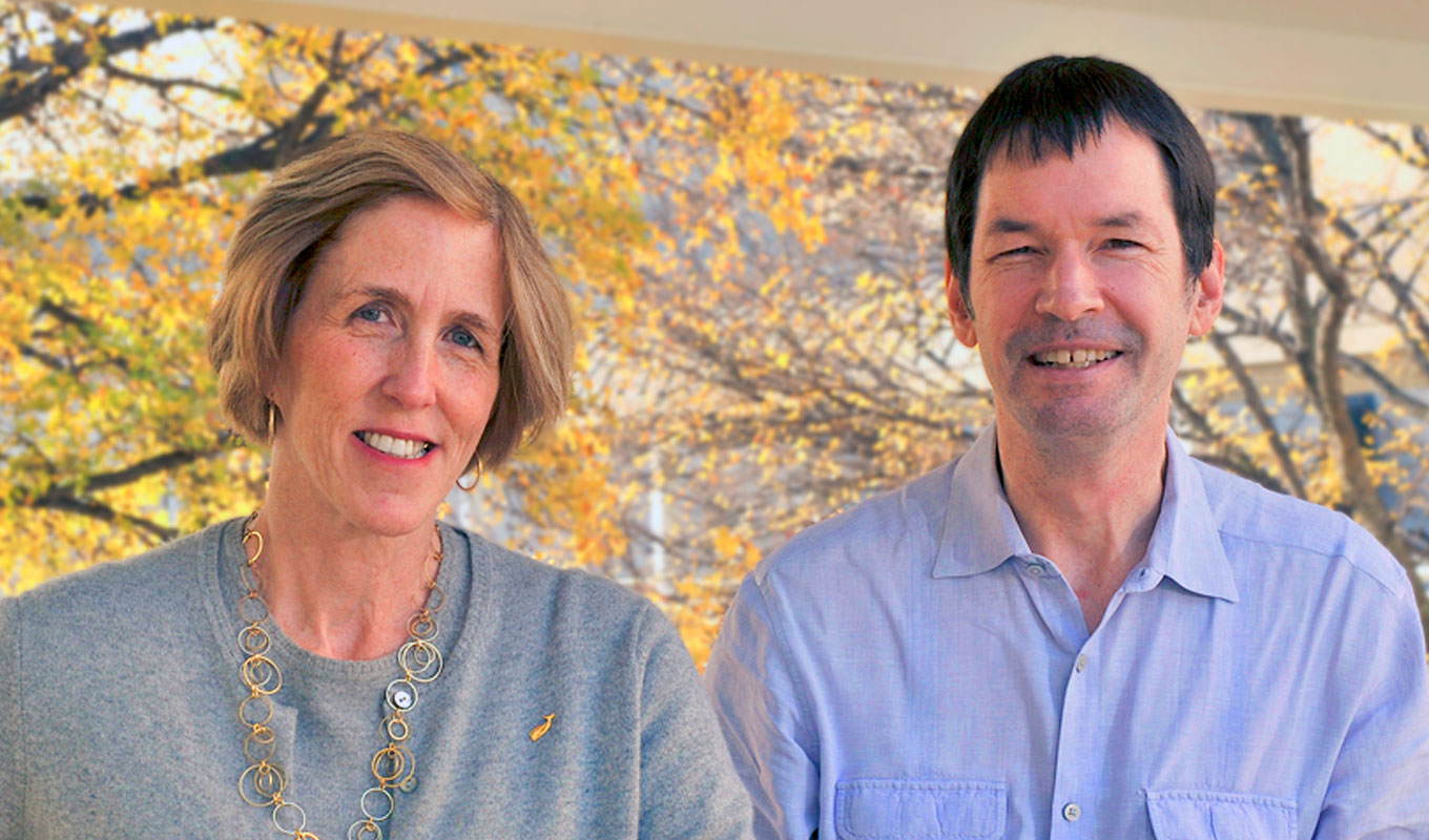 man and woman standing side-by-side outdoors