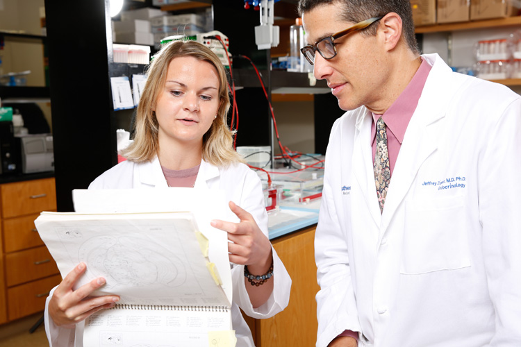 Anna Patterson and Dr. Zigman in the lab