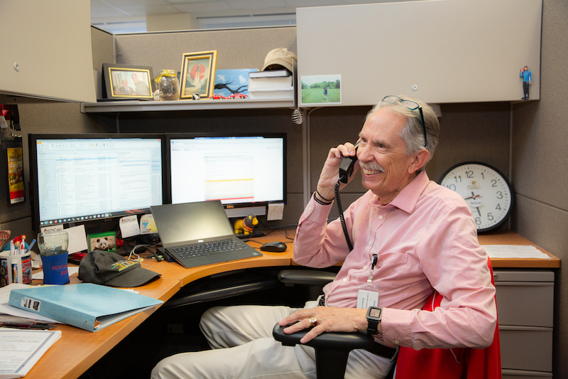 Bob Butsch on the phone at work