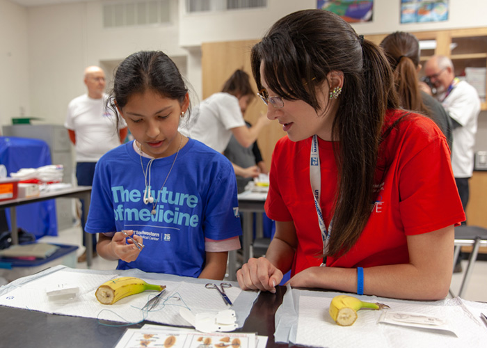 Learning about how to suture by practicing on a banana peel.