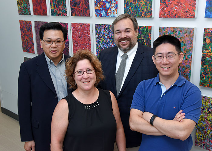From left: Dr. Andrew Young Koh, Patricia Plumb, RN, and Drs. Benjamin Greenberg and Xiaowei Zhan
