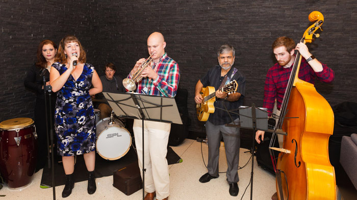 Band of six people playing music