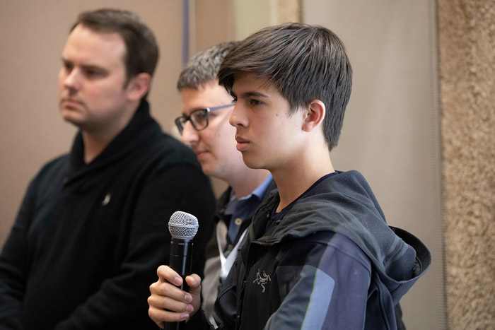 Young man holding a microphone