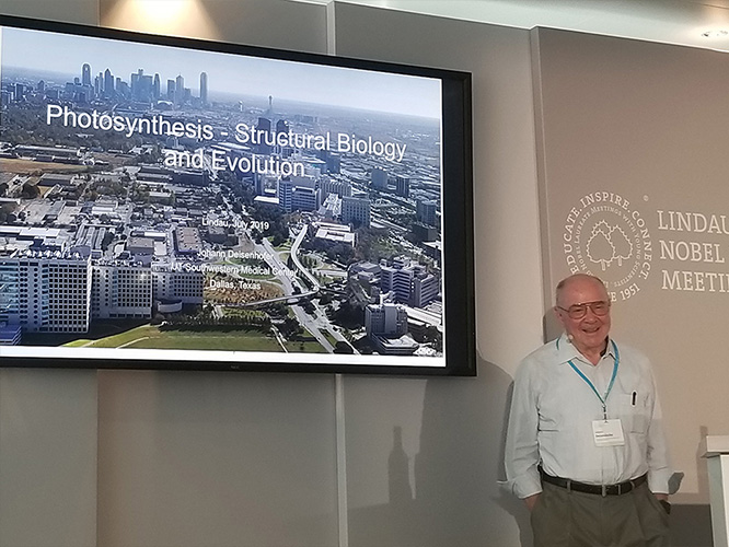Dr. Johann Deisenhofer speaking to attendees