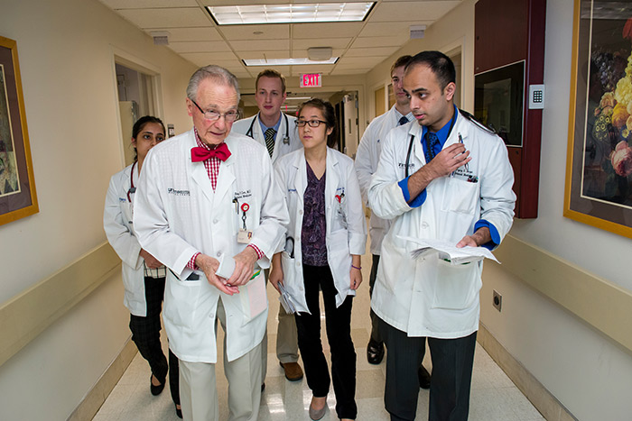 Group of doctors walking down a hallway