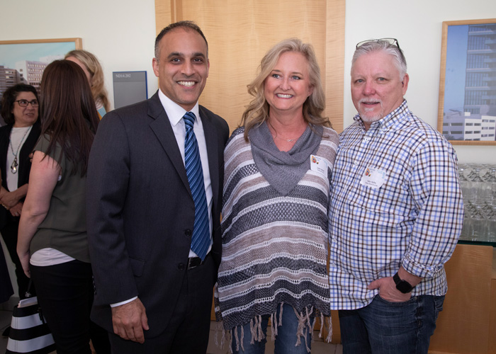 Dr. Parsia Vagefi reunites with patients Julie Harrell, a kidney transplant recipient, and Tod Hollis, a kidney donor. Mrs. Harrell and Mr. Hollis are family friends who participated in a kidney swap. Dr. Vagefi with patients Julie Harrell and Tod Hollis