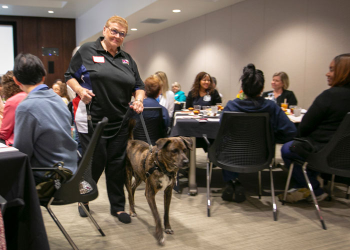 Roz Henwood of Heart of Texas Therapy Dogs with her Catahoula Lab mix, Rusty.