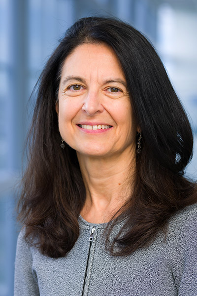 Woman with dark hair wearing sweater