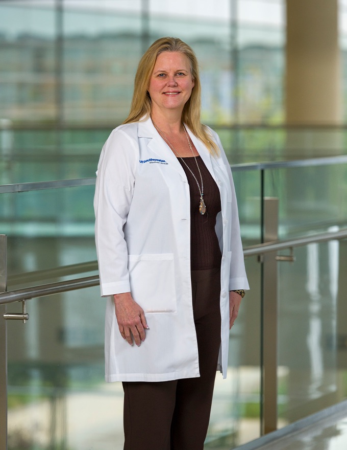 A woman in lab coat