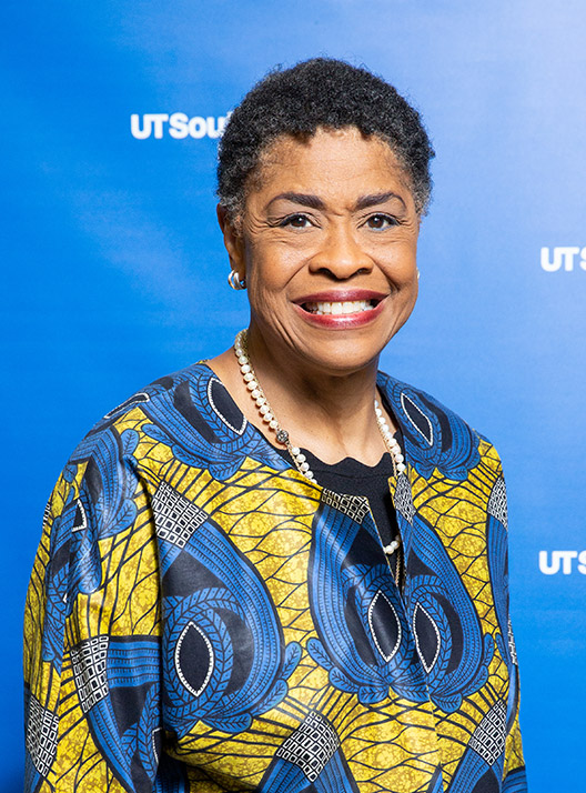 Woman in bright floral dress