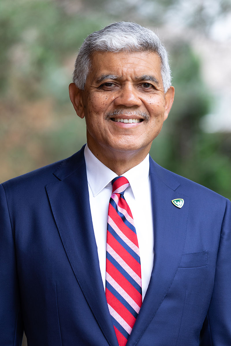 Man with white hair, blue suit