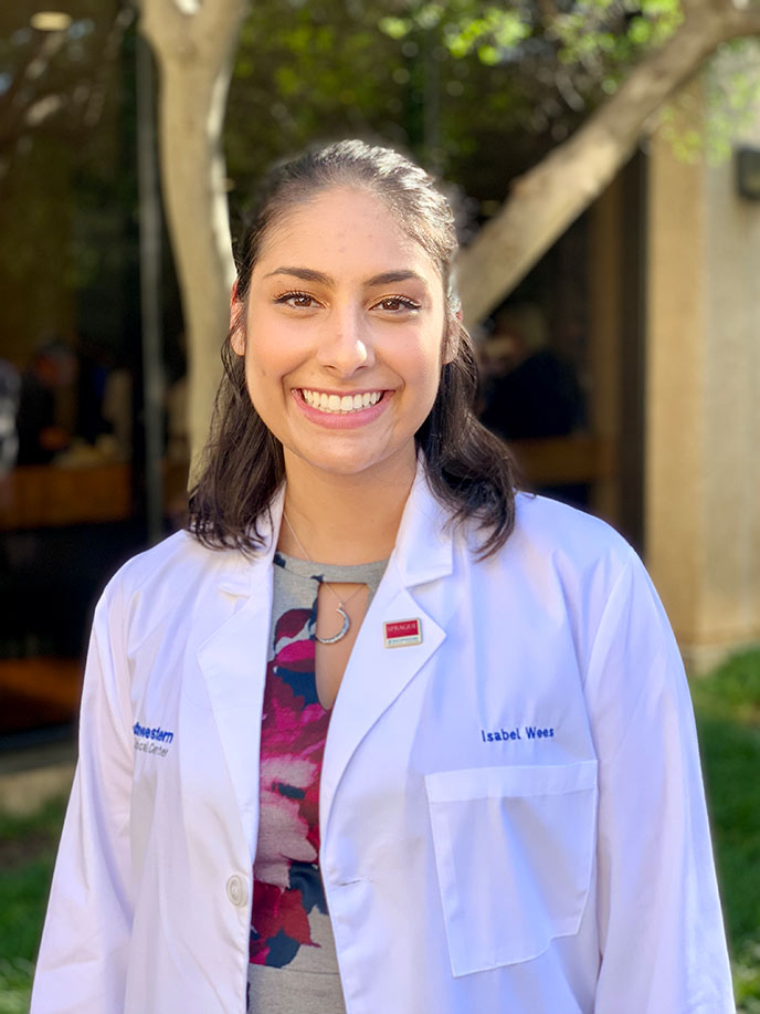 Woman in white lab coat