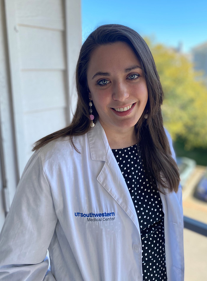 Woman in white lab coat