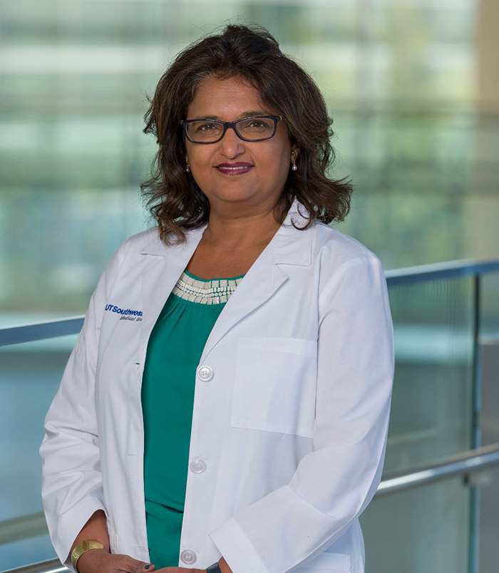 Woman in white lab coat