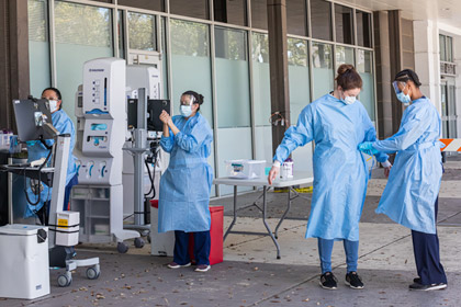 Medical staff outside a building
