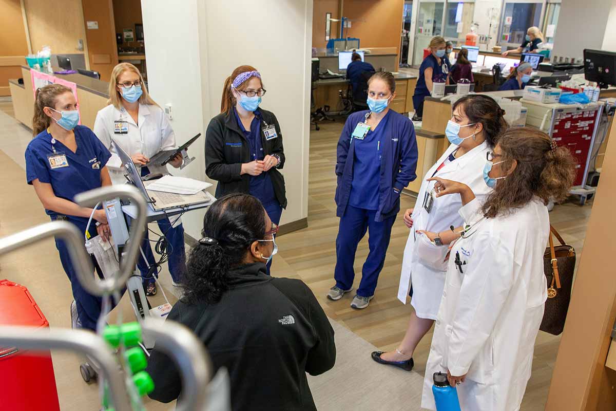 Hospital staff standing in circle