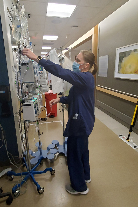 Woman checking on COVID patient