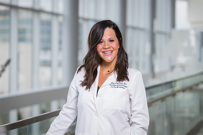 A woman wearing a lab coat