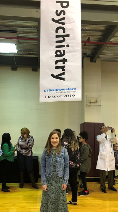 woman smiling under psychiatry banner