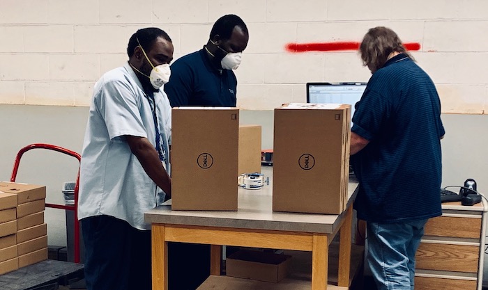 technicians preparing computer inventory