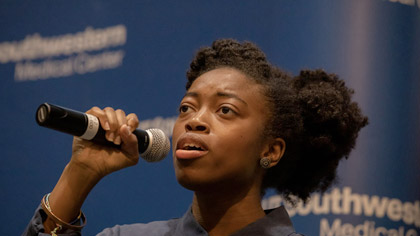 Woman singing into microphone