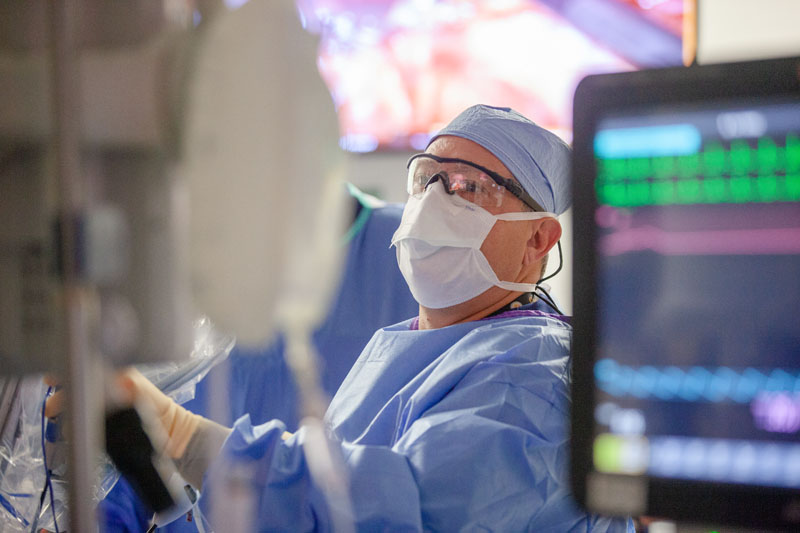 Man in surgical mask performing surgicle