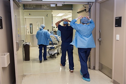 People donning surgical scrubs