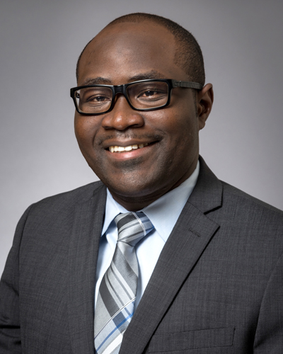 Man with glasses, gray suit