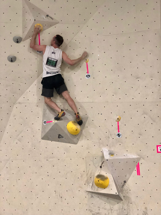 Man climbing rock wall